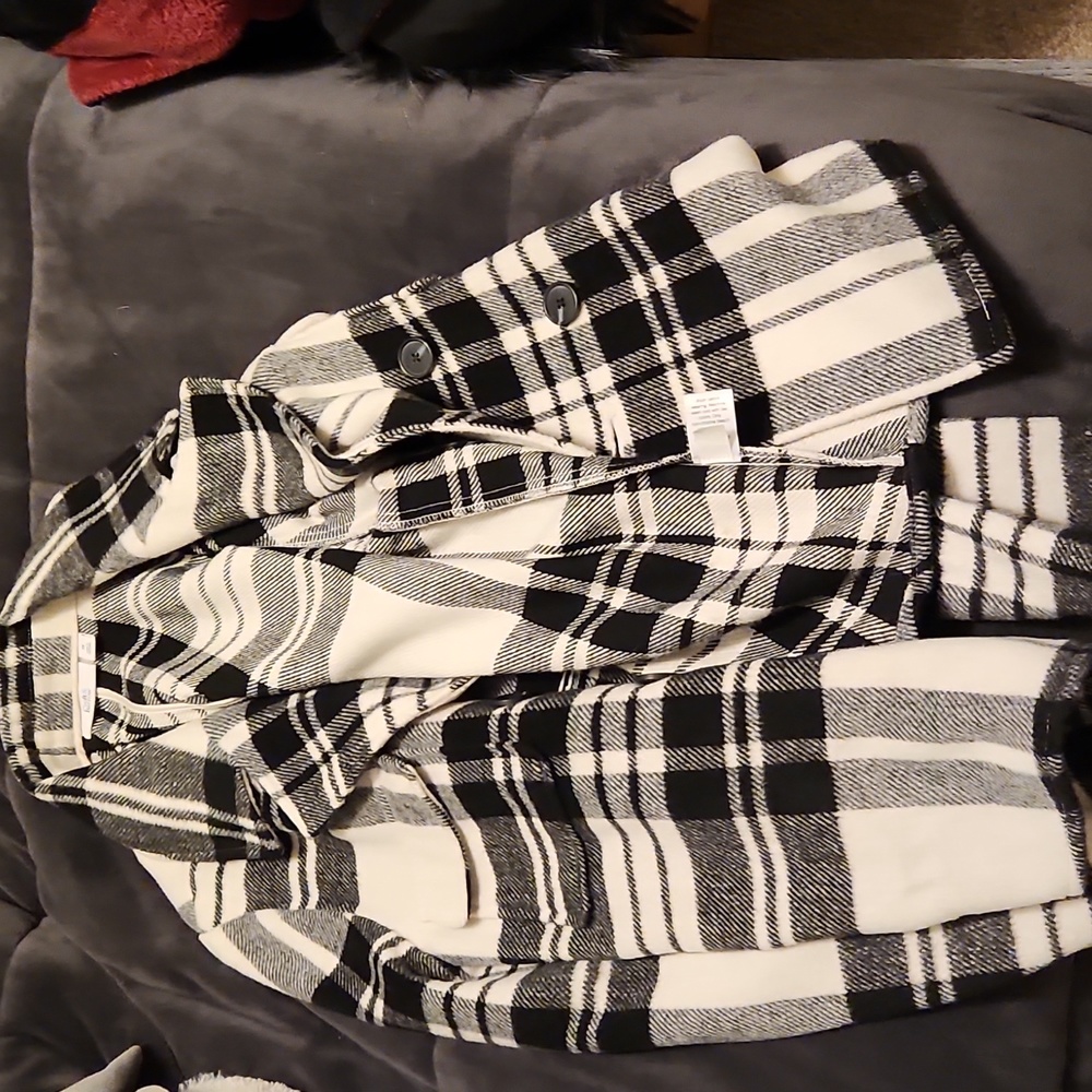 Woman's black and white plaid coat